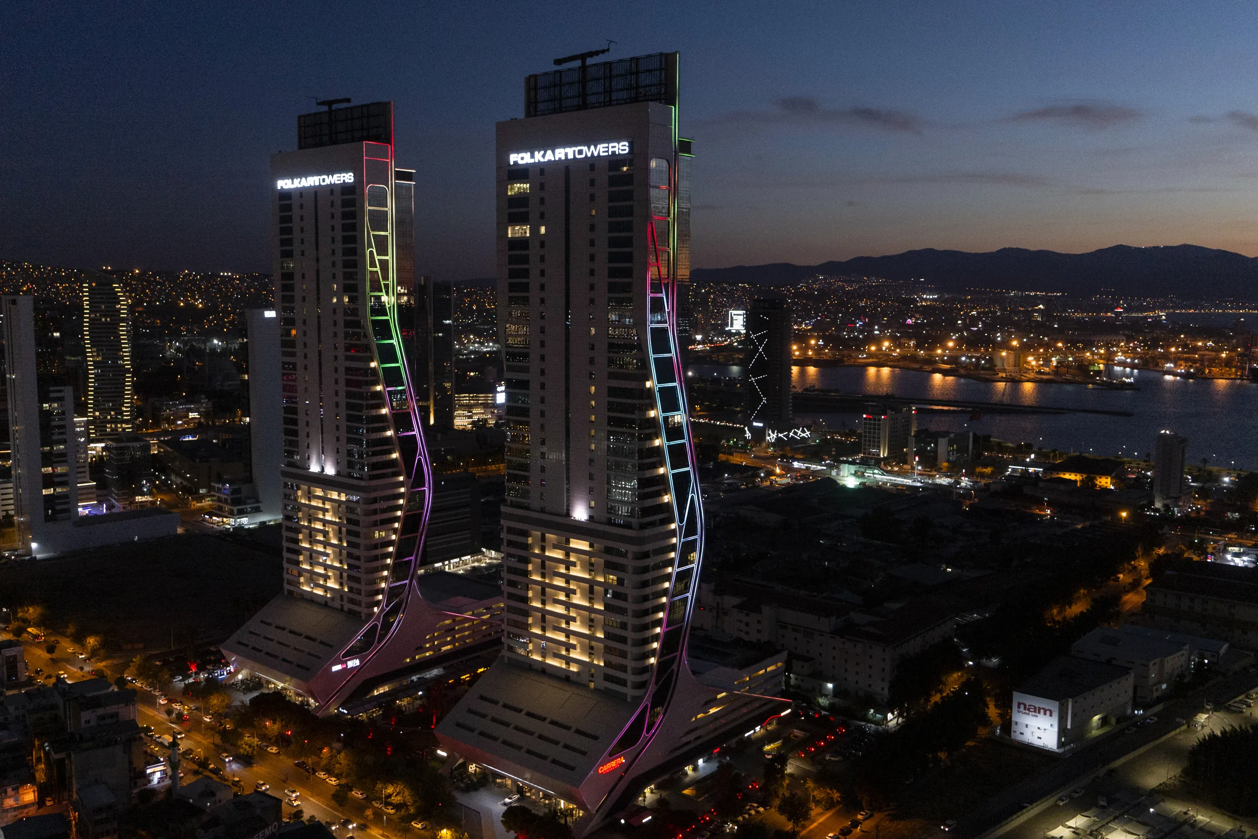Folkart Towers lit at dusk